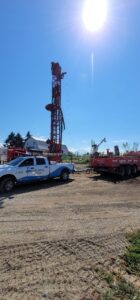 Water well drilling rig setup and drilling a new water well in King County, Washington.